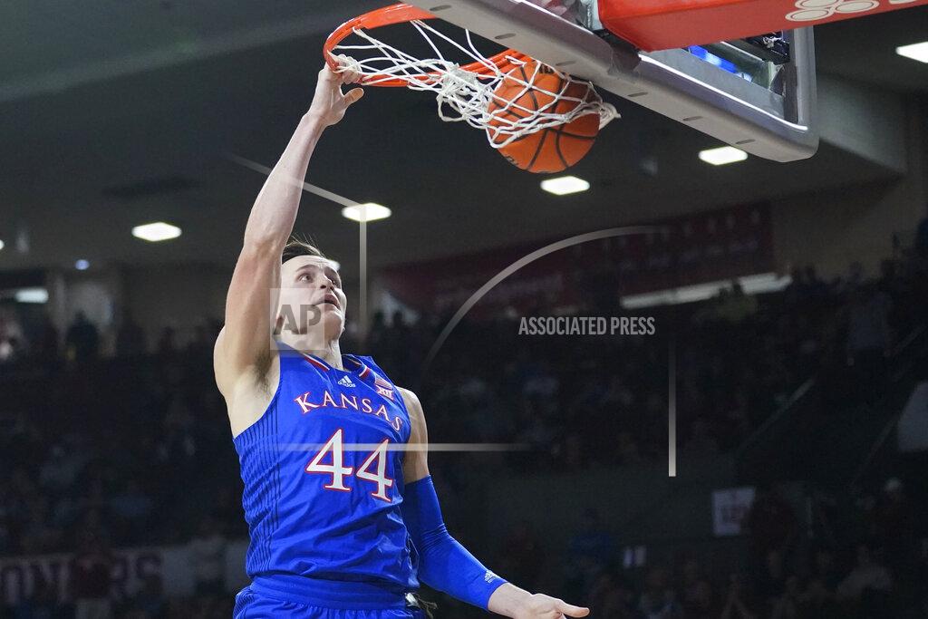 Sue Ogrocki Kansas forward Mitch Lightfoot (44) dunks in the first half of an NCAA college basketball game against Oklahoma, Tuesday, Jan. 18, 2022, in Norman, Okla. (AP Photo/Sue Ogrocki)