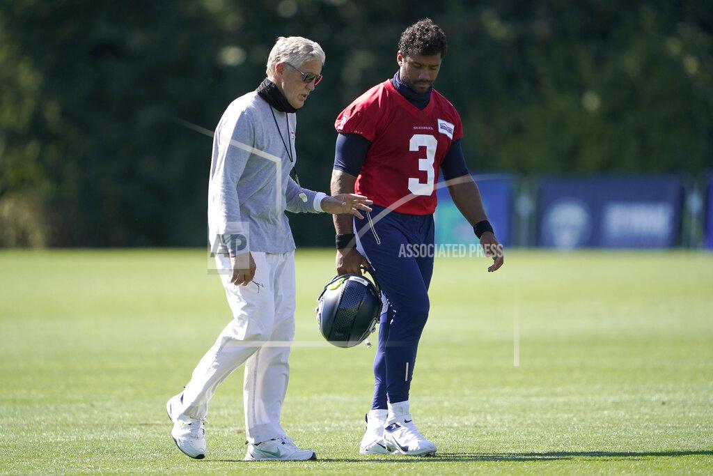 Ted S. Warren Seattle Seahawks quarterback Russell Wilson (3) walks with head coach Pete Carroll after the last day of NFL football training camp, Thursday, Sept. 3, 2020, in Renton, Wash. (AP Photo/Ted S. Warren)