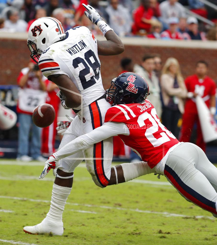 Rogelio V. Solis Auburn running back JaTarvious Whitlow (28) is hit from behind by Mississippi defensive back Jalen Julius (26) and fumbles the ball after a 54-yard run,in the second half of an NCAA college football game on Saturday, Oct. 20, 2018, in Oxford, Miss. Whitlow's fumble was recovered in the end zone for a touchdown by Auburn wide receiver Anthony Schwartz (5). Auburn won 31-16. (AP Photo/Rogelio V. Solis)