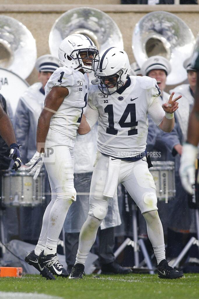 Al Goldis Penn State receiver KJ Hamler, left, and quarterback Sean Clifford (14) celebrate Hamler's touchdown reception against Michigan State during the second quarter of an NCAA college football game, Saturday, Oct. 26, 2019, in East Lansing, Mich. (AP Photo/Al Goldis)