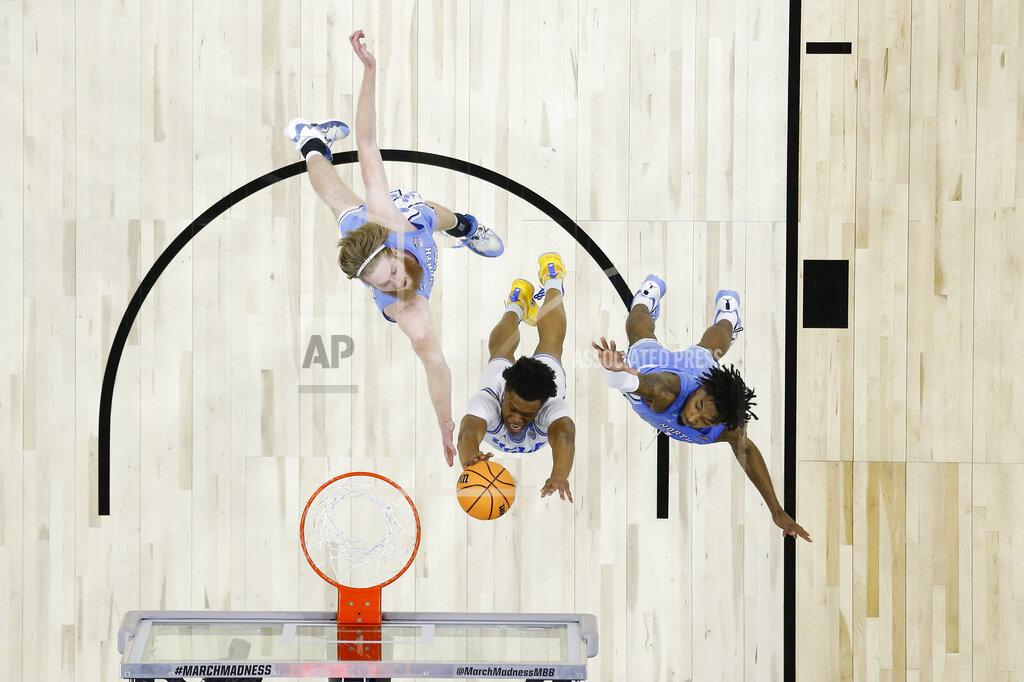 Chris Szagola UCLA's Jaylen Clark, center, goes up for a shot between North Carolina's Brady Manek, left, and Leaky Black during the second half of a college basketball game in the Sweet 16 round of the NCAA tournament, Friday, March 25, 2022, in Philadelphia. (AP Photo/Chris Szagola)