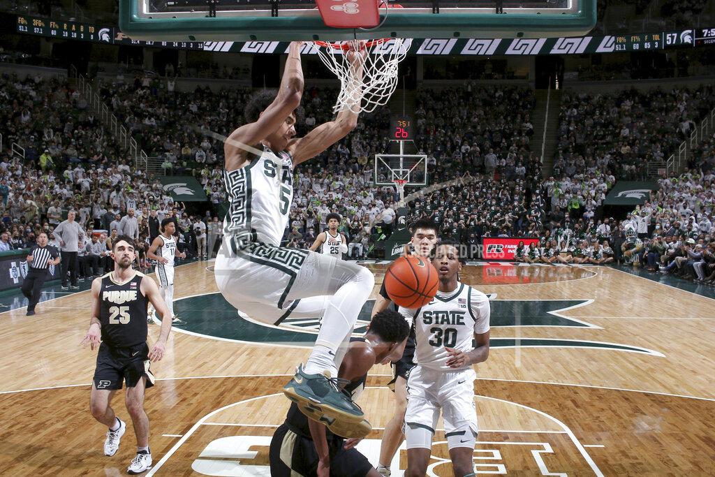 Al Goldis Michigan State's Max Christie (5) dunks over Purdue's Eric Hunter Jr. during the second half of an NCAA college basketball game, Saturday, Feb. 26, 2022, in East Lansing, Mich. Michigan State won 68-65. (AP Photo/Al Goldis)