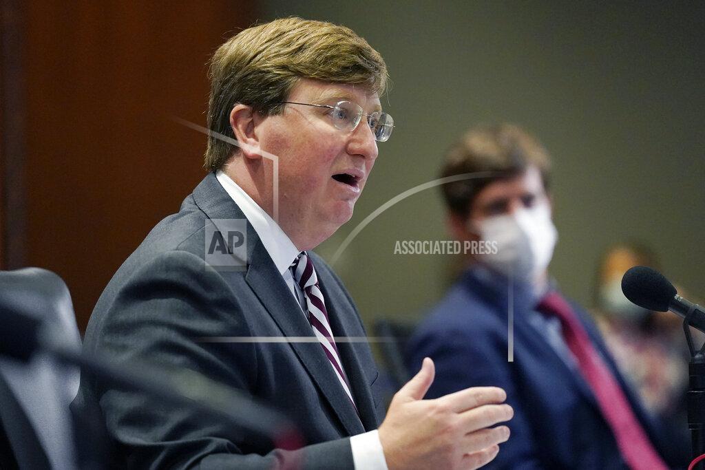State Health Officer Dr. Thomas Dobbs, right, listens as Mississippi Gov. Tate Reeves, left, explains his rationale for not ordering a statewide mask mandate as some health officials have recently called on him to do so, during his COVID-19 briefing before reporters, Tuesday, Nov. 24, 2020 in Jackson, Miss. (AP Photo/Rogelio V. Solis)