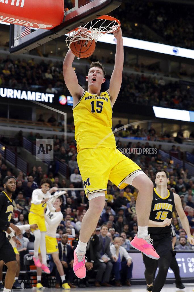 Nam Y. Huh Michigan's Jon Teske (15) dunks during the second half of an NCAA college basketball game against Iowa in the quarterfinals of the Big Ten Conference tournament, Friday, March 15, 2019, in Chicago. (AP Photo/Nam Y. Huh)