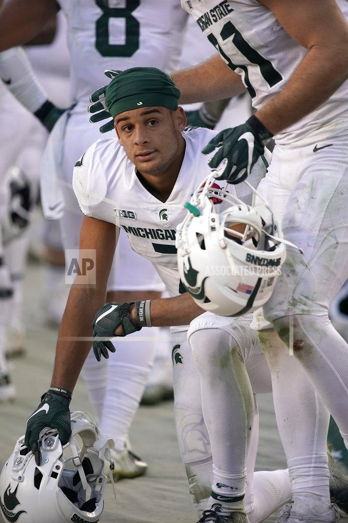 Tony Avelar Michigan State wide receiver Cody White (7) is consoled by teammate after the team's 7-6 loss to Oregon during the Redbox Bowl NCAA college football game Monday, Dec. 31, 2018, in Santa Clara, Calif. (AP Photo/Tony Avelar)
