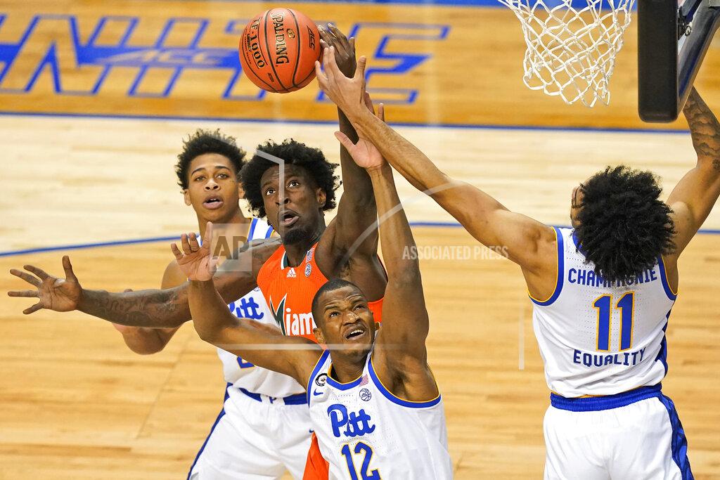 Gerry Broome Miami center Nysier Brooks (3) blocks the shot of Pittsburgh forward Abdoul Karim Coulibaly (12) along with Pittsburgh forward Justin Champagnie (11) during the first half an NCAA college basketball game in the first round of the Atlantic Coast Conference tournament in Greensboro, N.C., Tuesday, March 9, 2021. (AP Photo/Gerry Broome)