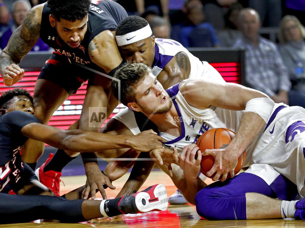 Charlie Riedel Texas Tech's Jarrett Culver, left, tries to steal the ball from Kansas State's Dean Wade during the second half of an NCAA college basketball game Tuesday, Jan. 22, 2019, in Manhattan, Kan. Kansas State won 58-45. (AP Photo/Charlie Riedel)