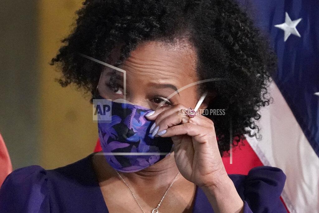 Elise Amendola Former Boston City Council President Kim Janey, 55, wipes a tear as she is introduced to be sworn in as Boston's new mayor at City Hall, Wednesday, March 24, 2021, in Boston. Janey, who is the city's first female and first person of color to take the office, replaces Marty Walsh who resigned Monday evening to become President Joe Biden's labor secretary. (AP Photo/Elise Amendola)