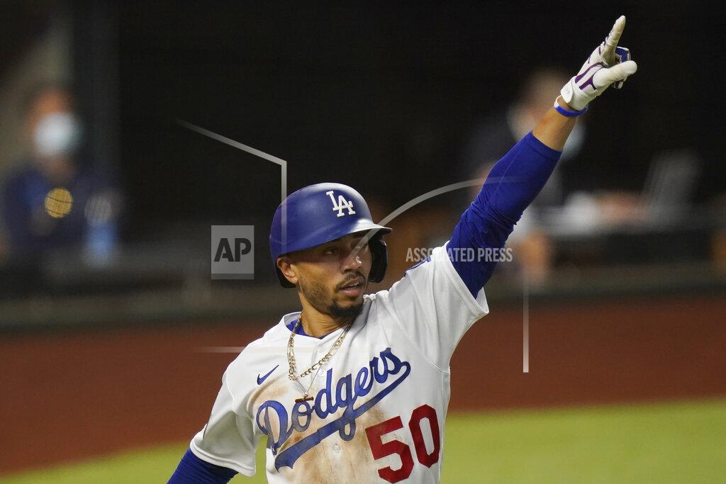 Eric Gay Los Angeles Dodgers' Mookie Betts celebrates a home run against the Tampa Bay Rays during the sixth inning in Game 1 of the baseball World Series Tuesday, Oct. 20, 2020, in Arlington, Texas. (AP Photo/Eric Gay)