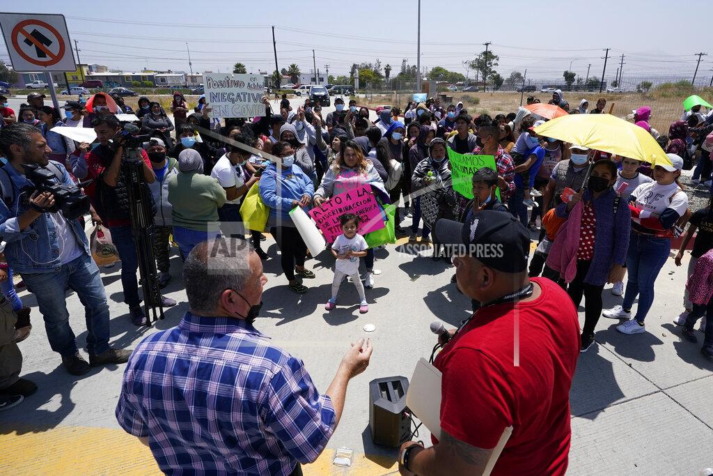 Gregory Bull FILE - People gather as Rev. Albert Rivera, bottom left, speaks during a protest of people waiting in Mexico as they hope to apply for asylum, May 19, 2022, in Tijuana, Mexico. The Supreme Court has ruled that the Biden administration properly ended a Trump-era policy forcing some U.S. asylum-seekers to wait in Mexico. The justices’ 5-4 decision for the administration came in a case about the “Remain in Mexico” policy under President Donald Trump. (AP Photo/Gregory Bull, File)