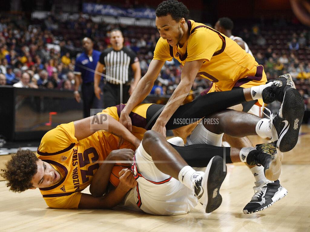 Jessica Hill Arizona State's Taeshon Cherry, left, and Arizona State's Jaelen House, right, scramble for the ball against St. John's Marcellus Earlington during the second half of an NCAA college basketball game, Saturday, Nov. 23, 2019, in Uncasville, Conn. (AP Photo/Jessica Hill)