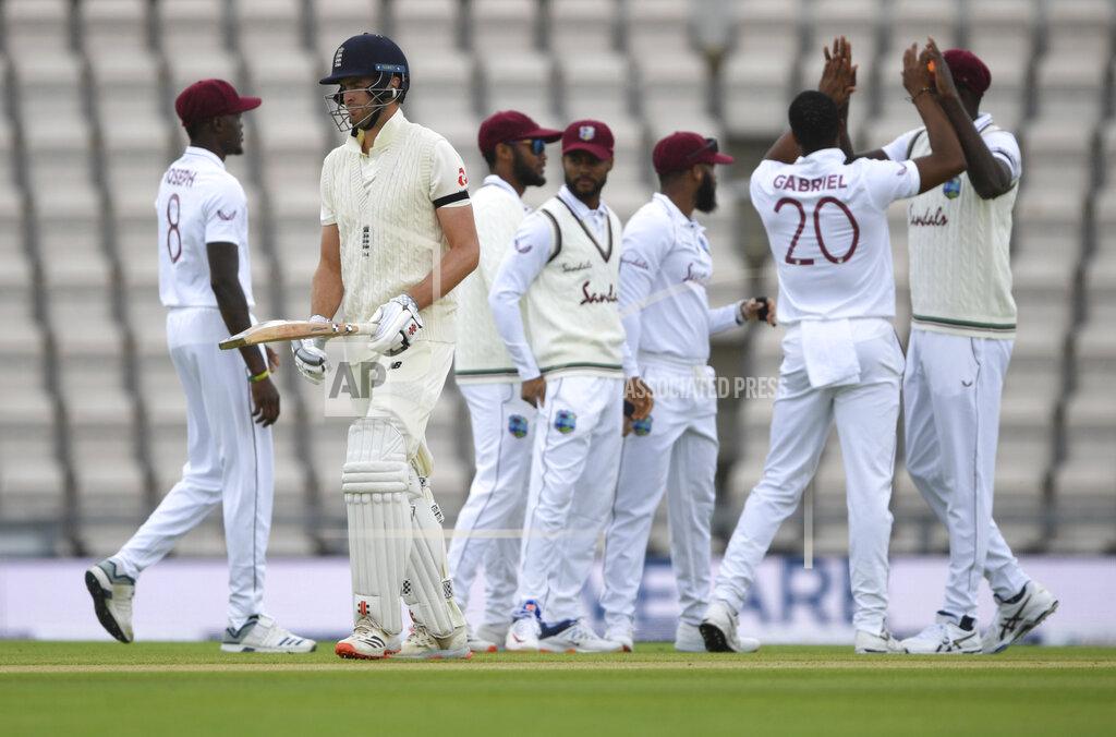 Mike Hewitt England's Dom Sibley, second left, leaves the field after being dismissed by West Indies' Shannon Gabriel, second right, during the first day of the 1st cricket Test match between England and West Indies, at the Ageas Bowl in Southampton, England, Wednesday July 8, 2020. (Mike Hewitt/Pool via AP)