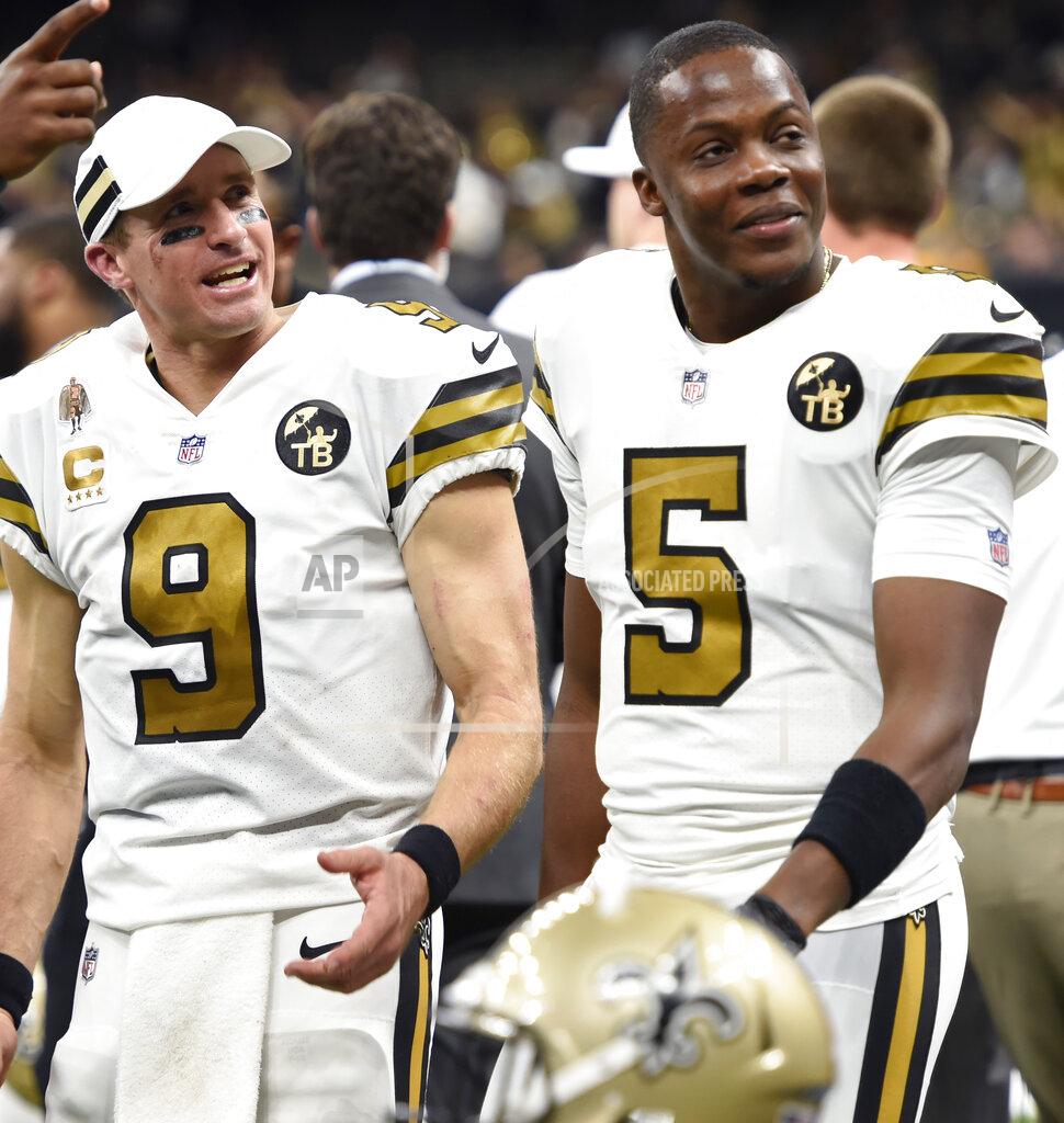 Bill Feig FILE - In this Nov. 18, 2018, file photo, New Orleans Saints quarterbacks Drew Brees and Teddy Bridgewater (5) chat on the sideline in the second half of an NFL football game against the Philadelphia Eagles in New Orleans. The Saints have agreed to terms on a deal Friday, March 15, 2019, with free agent quarterback Teddy Bridgewater to keep him as Drew Brees' main backup. (AP Photo/Bill Feig, File)