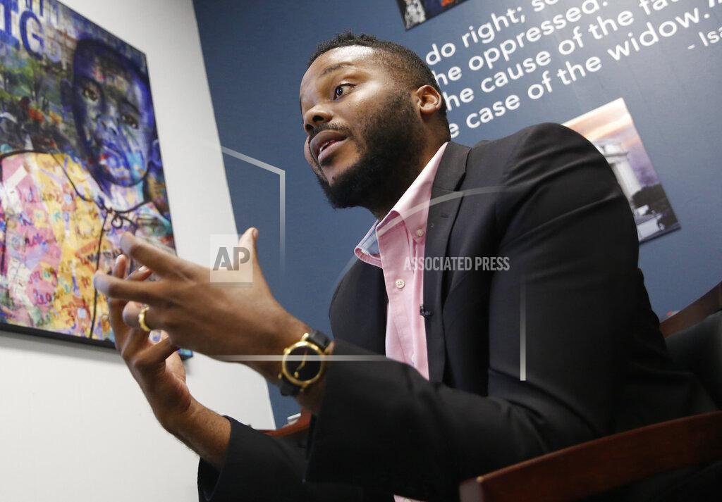 FILE -- In this Wednesday Aug. 14, 2019, file photo Stockton Mayor Michael Tubbs talks during an interview in Stockton, Calif. Mayors across the country are committing to give cash to low-income families with no restrictions on how they can spend it. It's part of a growing movement to establish a guaranteed minimum income as a way to combat poverty and systemic racism. Tubbs, launched one of the country's first guaranteed income programs last year with the help of private donations. (AP Photo/Rich Pedroncelli, File)