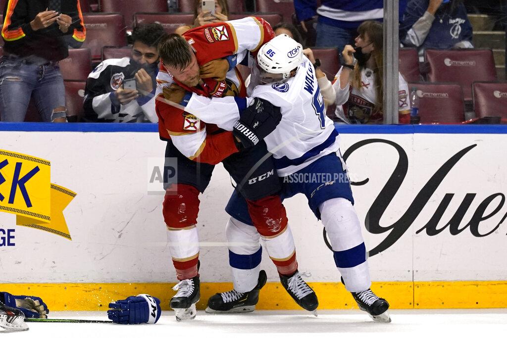 Lynne Sladky Florida Panthers defenseman Kevin Connauton, left, and Tampa Bay Lightning defenseman Daniel Walcott (85) fight during the second period of an NHL hockey game, Monday, May 10, 2021, in Sunrise, Fla. (AP Photo/Lynne Sladky)