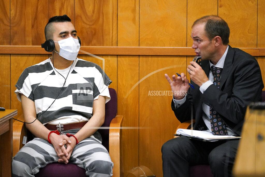 Charlie Neibergall Cristhian Bahena Rivera, left, listens to proceedings through an interpreter during his sentencing, Monday, Aug. 30, 2021, at the Poweshiek County Courthouse in Montezuma, Iowa. Rivera was sentenced to life in prison for the stabbing death of college student Mollie Tibbetts, who was abducted as she was out for a run near her small eastern Iowa hometown in July of 2018. (AP Photo/Charlie Neibergall, pool)