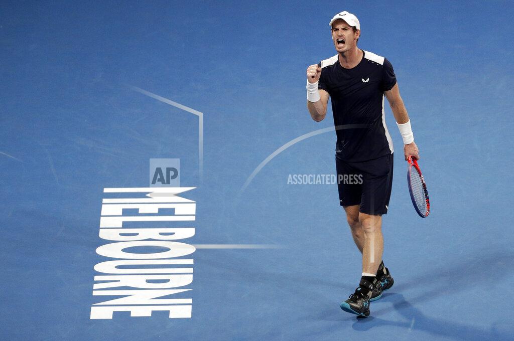 FILE - In this Jan 14, 2019, file photo, Britain's Andy Murray reacts after winning a point against Spain's Roberto Bautista Agut during their first round match at the Australian Open tennis championships in Melbourne, Australia. Five-time Australian Open finalist Murray has been given a wild-card entry into the first Grand Slam tournament of next year. (AP Photo/Mark Schiefelbein, File)
