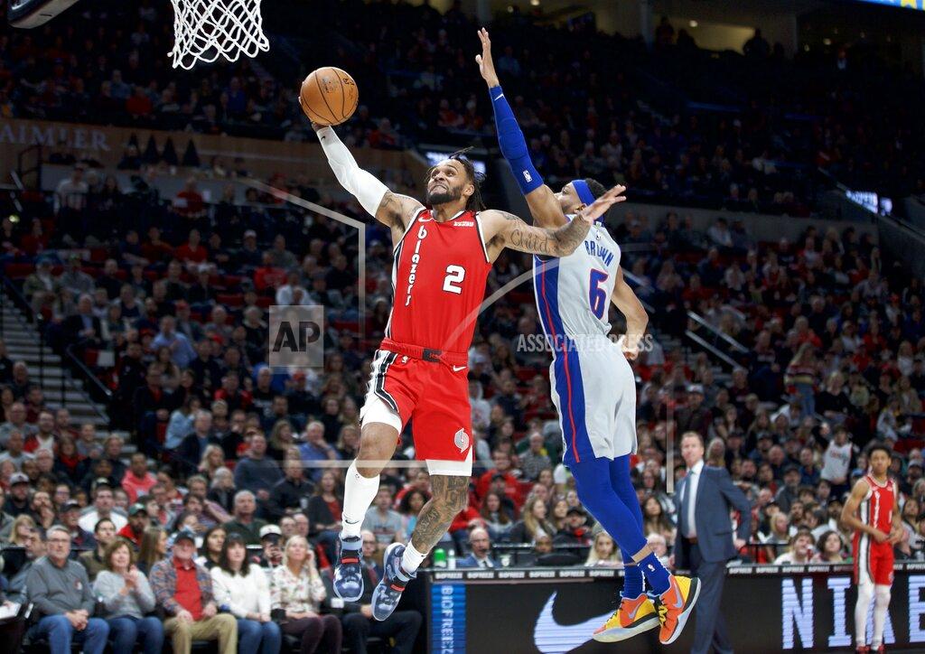 Craig Mitchelldyer FILE - In this Feb. 23, 2020, file photo, Portland Trail Blazers guard Gary Trent Jr., left, shoots over Detroit Pistons guard Bruce Brown during the first half of an NBA basketball game in Portland, Ore. Trent showed flashes of his potential in the month prior to the pandemic, as he scored 22 against Miami on Feb. 9, 20 against Indiana on Feb. 27 and 24 against Orlando on March 2. The 6-5 guard has averaged 7.7 points and 20 minutes but likely will get more playing time now that teammate Trevor Ariza has opted out of the restart. (AP Photo/Craig Mitchelldyer, File)