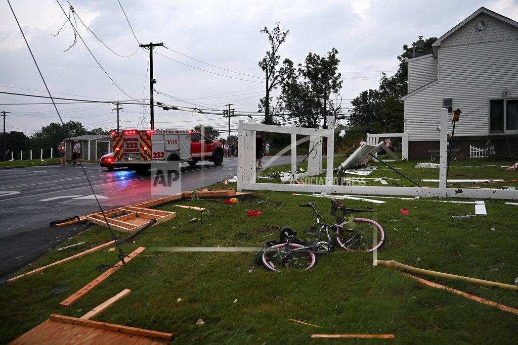 Tom Gralish Debris is scattered in the Penn Valley Terrace trailer park after a tornado hit in Trevose, Pa. Thursday, July 29, 2021. Five people were injured Thursday when a building at a Bensalem auto dealership was destroyed by severe weather, authorities said. The National Weather Service confirmed two tornados touched down in Bucks County, sending trees falling and debris flying.(Tom Gralish/The Philadelphia Inquirer via AP)