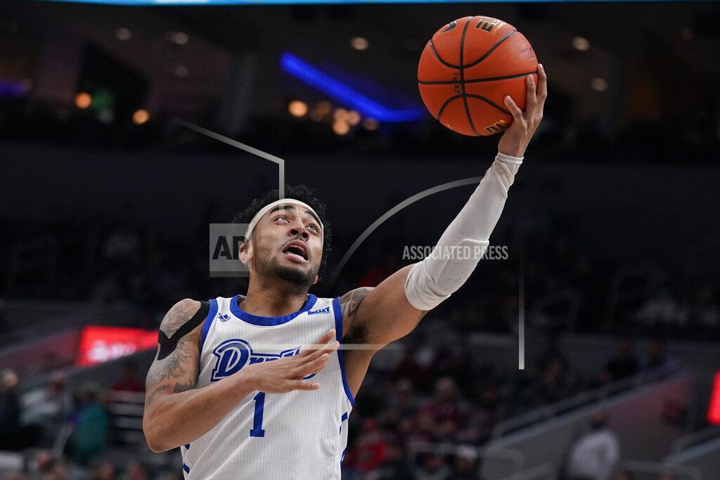 Jeff Roberson Drake's Roman Penn heads to the basket during the first half of an NCAA college basketball game against Southern Illinois in the quarterfinal round of the Missouri Valley Conference tournament Friday, March 4, 2022, in St. Louis. (AP Photo/Jeff Roberson)