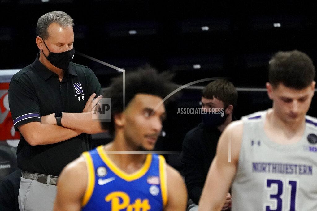 Nam Y. Huh Northwestern head coach Chris Collins, left, reacts as he watches his team during the second half of an NCAA college basketball game against Pittsburgh in Evanston, Ill., Wednesday, Dec. 9, 2020. Pittsburgh won 71-70. (AP Photo/Nam Y. Huh)