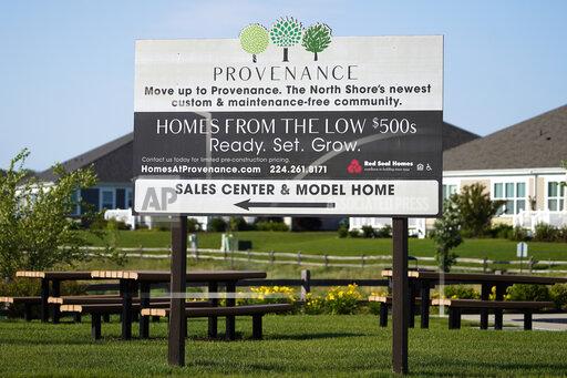 A homes sale sign is shown in front of a new home construction site in Northbrook, Ill., Wednesday, June 23, 2021. U.S. home prices rose briskly in September, another sign that the housing market is booming in the aftermath of last year's coronavirus recession. (AP Photo/Nam Y. Huh)