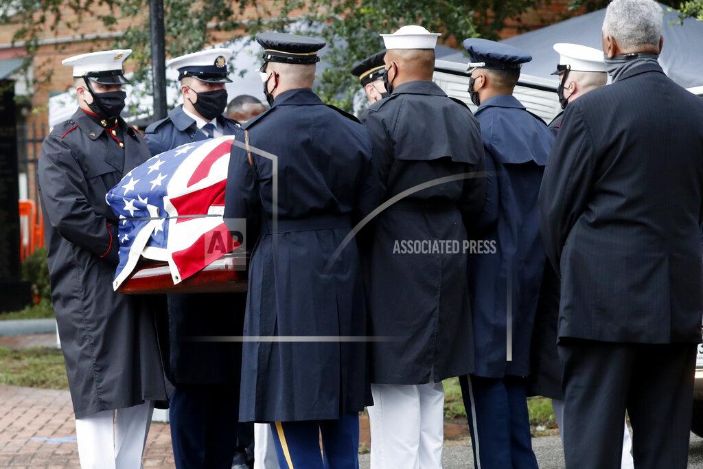 John Bazemore A military honor guard carries the casket of Rep. John Lewis during a memorial service at Brown Chapel A.M.E. Church, Saturday, July 25, 2020, in Selma, Ala. Lewis, who carried the struggle against racial discrimination from Southern battlegrounds of the 1960s to the halls of Congress, died Friday, July 17, 2020. (AP Photo/John Bazemore)