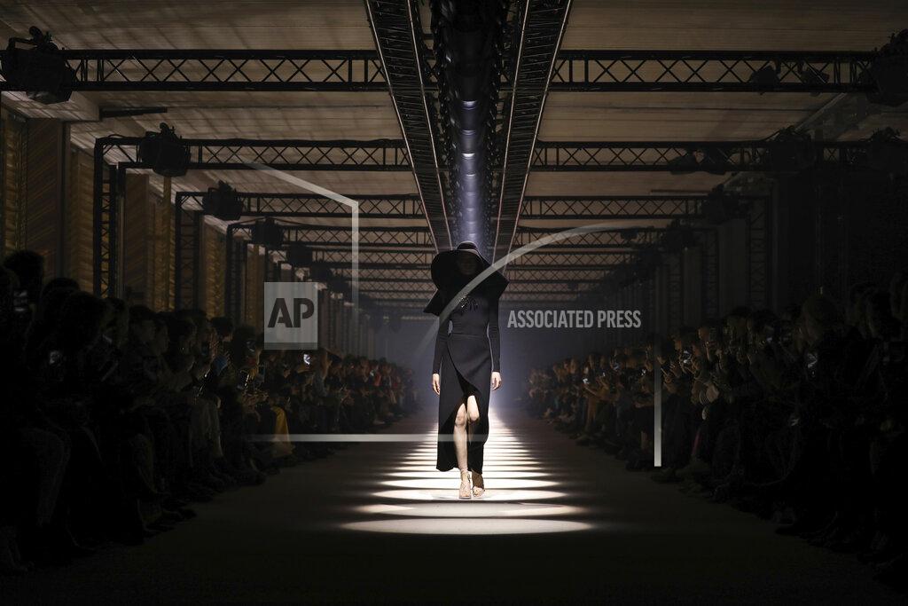 Vianney Le Caer FILE - In this March 1, 2020 file photo, a model wears a creation for the Givenchy fashion collection during Women's fashion week Fall/Winter 2020/21 presented in Paris. The coronavirus pandemic has instilled extra unpredictability into the already fickle Paris Fashion Week. After first canceling the July shows for menswear and Haute Couture, the French fashion federation has now organized an unprecedented schedule of digital-only events instead. (Photo by Vianney Le Caer/Invision/AP, File)