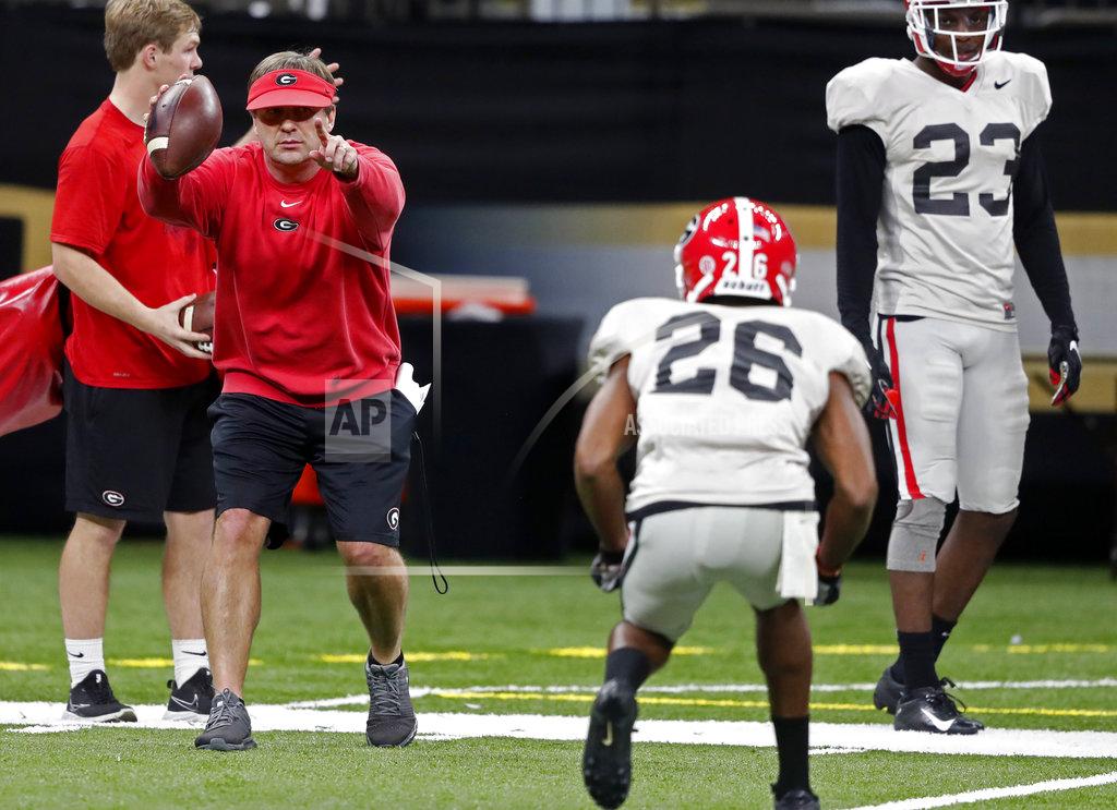 Gerald Herbert Georgia head coach Kirby Smart runs a drill as defensive back Tyrique McGhee (26) lines up at the Superdome in New Orleans, Friday, Dec. 28, 2018. Georgia will face Texas in the Sugar Bowl NCAA college football game on Jan. 1, 2019. (AP Photo/Gerald Herbert)
