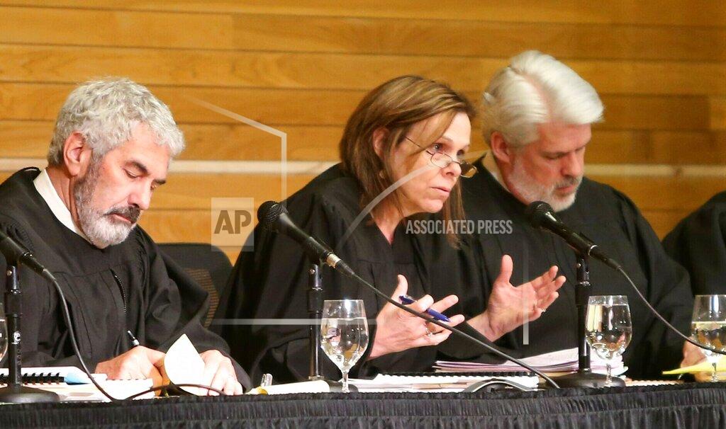 FILE - In this April 27, 2016, file photo, Montana Supreme Court Justice Laurie McKinnon asks a question during arguments in the Jon Krakauer records request hearing at the Strand Union Building at Montana State University in Bozeman, Mont. Author Jon Krakauer's five-year quest to find out how and why Montana's top higher education official intervened to prevent a star college quarterback's expulsion over a rape accusation stalled Wednesday, July 3, 2019, when the state Supreme Court denied him access to those records. (Casey Page/Billings Gazette via AP, File)
