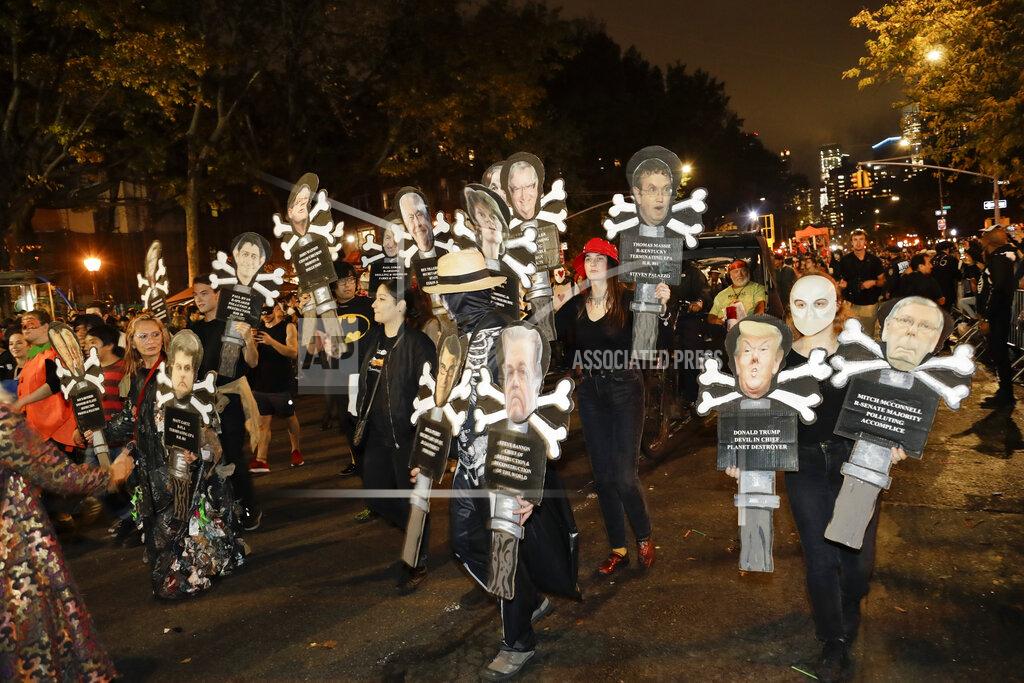 Frank Franklin Ii FILE- In this Oct. 31, 2019 file photo, revelers march in the Greenwich Village Halloween Parade in New York. This year's parade was canceled by the coronavirus pandemic, but fun and spooky activities planned around the city included a puppet parade, an Empire State Building memory game and socially distant trick-or-treating. (AP Photo/Frank Franklin II)