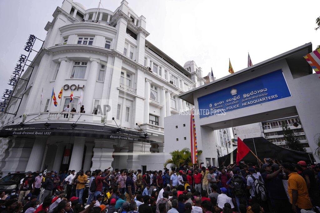 Eranga Jayawardena Members of Socialist Youth Union shout slogans blocking the entrance to Sri Lanka's police headquarters during a protest in Colombo, Sri Lanka, Monday, May 16, 2022. Sri Lanka’s prime minister on Monday proposed to privatize the country’s loss-making national carrier as part of reforms to solve the country worst economic crisis in recent memory. (AP Photo/Eranga Jayawardena)