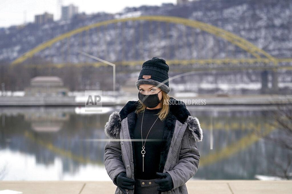 Keith Srakocic In this photo made on Monday, Feb. 8, 2021, Allissa Star poses for a photograph along the north shore of the Allegheny River in Pittsburgh. Starr worked about a week every month at a brothel in Pahrump, Nev., outside of Las Vegas. Then the pandemic led to the shuttering of Nevada's licensed bordellos, the only place where prostitution is legal in the state, and they have remained closed since March, leaving sex workers like Starr struggling to pay the bills and turning to alternatives like "virtual" dates. (AP Photo/Keith Srakocic)