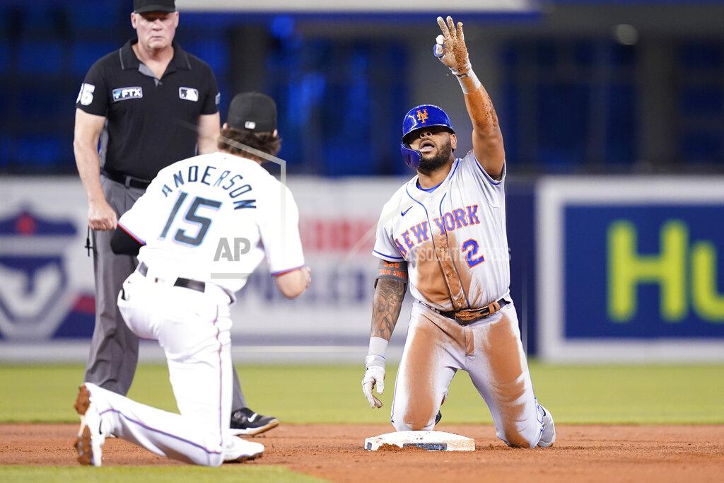 Lynne Sladky New York Mets' Dominic Smith (2) reacts after hitting a double during the second inning of a baseball game against the Miami Marlins, Wednesday, Aug. 4, 2021, in Miami. At left is Miami Marlins third baseman Brian Anderson (15). (AP Photo/Lynne Sladky)