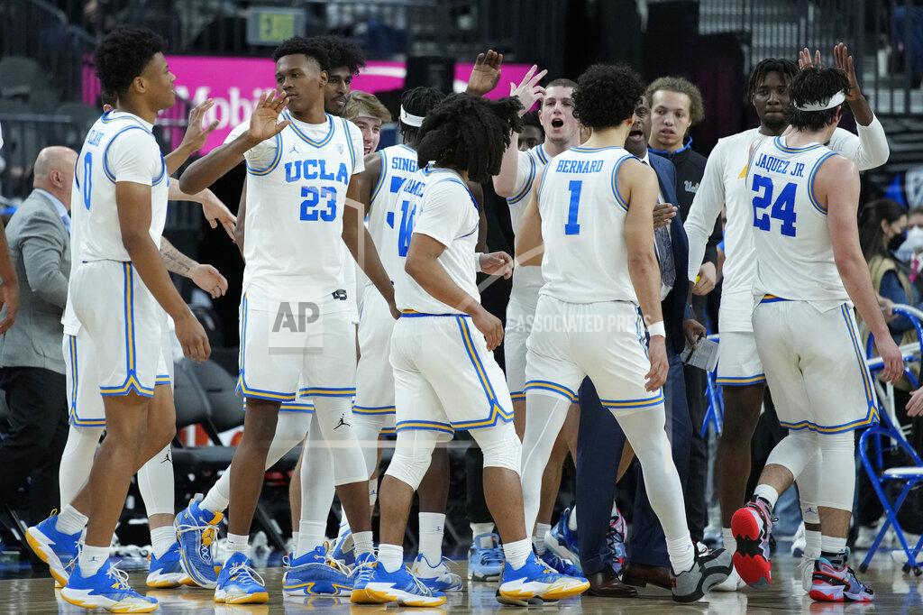 John Locher UCLA players celebrate during the second half of an NCAA college basketball game against Southern California in the semifinal round of the Pac-12 tournament Friday, March 11, 2022, in Las Vegas. (AP Photo/John Locher)