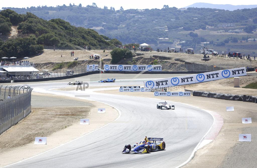 Elias Funez Alexander Rossi exits turn 3 and enters turn 4 Sunday at Laguna Seca.(Elias Funez/The Union via AP)