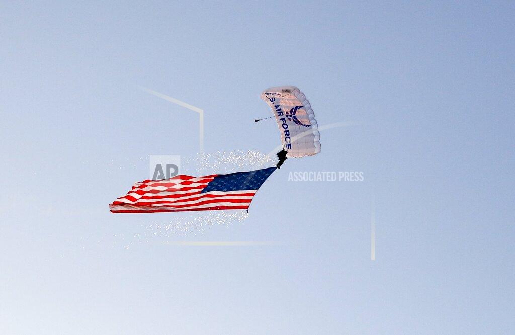 Charles Rex Arbogast A member of the U.S. Air Force parachutes into Soldier Field before an NFL football game between the Green Bay Packers and the Chicago Bears Thursday, Sept. 5, 2019, in Chicago. (AP Photo/Charles Rex Arbogast)