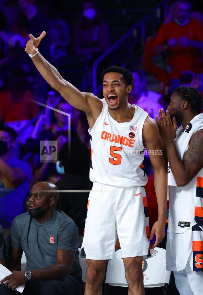 Tim Aylen In a photo provided by Bahamas Visual Services, Syracuse center Frank Anselem (5) celebrates during the team's NCAA college basketball game against Arizona State at Paradise Island, Bahamas, Thursday, Nov. 25, 2021. (Tim Aylen/Bahamas Visual Services via AP)