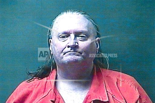 This booking photo provided by the LaPorte County Sheriff’s Office shows Thomas Holifield, 59, who is charged with murder in the June 1, 2021, methanol poisoning death of 64-year-old Pamela Keltz, according to Michigan City, Ind., police and the LaPorte County coroner. Holifield allegedly killed his roommate by repeatedly spiking her beverages with windshield washer fluid because he felt she was disrespecting him by not approving of his heavy drinking, authorities said. (LaPorte County Sheriff’s Office via AP