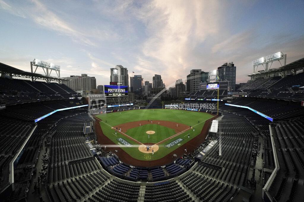 Jae C. Hong FILE - In this Oct. 6, 2020, file photo, the Tampa Bay Rays and the New York Yankees play in Game 2 of a baseball AL Division Series in an empty Petco Park in San Diego. Major League Baseball and all 30 of its teams are suing their insurance providers, citing billions of dollars in losses during the 2020 season played almost entirely without fans due to the coronavirus pandemic. The suit, filed in October in California Superior Court in Alameda County, was obtained Friday, Dec. 4, by The Associated Press. It says providers AIG, Factory Mutual and Interstate Fire and Casualty Company have refused to pay claims made by MLB despite the league's “all-risk” policy purchases. (AP Photo/Jae C. Hong, File)