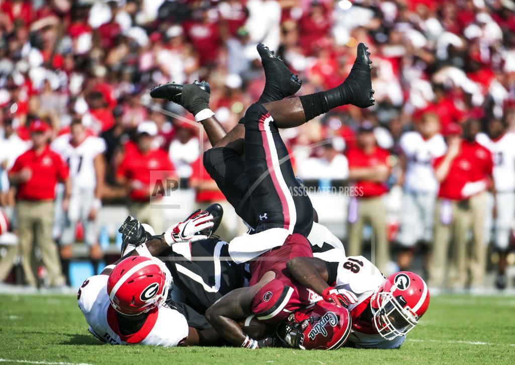 Sean Rayford South Carolina wide receiver Deebo Samuel (1) is tackled by Georgia defensive back J.R. Reed, left, and Deandre Baker (18) during the first half of an NCAA college football game Saturday, Sept. 8, 2018, in Columbia, S.C. (AP Photo/Sean Rayford)