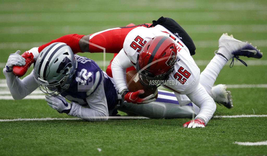 Orlin Wagner Kansas State defensive back AJ Parker (12) tackles Texas Tech running back Ta'Zhawn Henry (26) during the first half of an NCAA college football game in Manhattan, Kan., Saturday, Nov. 17, 2018. (AP Photo/Orlin Wagner)