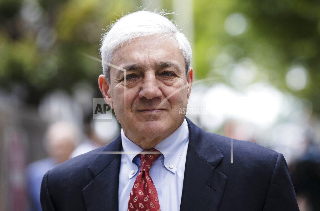 FILE - In this June 2, 2017, file photo, former Penn State President Graham Spanier departs after his sentencing hearing in Harrisburg, Pa. Pennsylvania prosecutors want a judge to order former Penn State president Graham Spanier to begin serving a county jail sentence for endangering children by the way he responded to a complaint that Jerry Sandusky had attacked a boy on campus. (AP Photo/Matt Rourke, File)