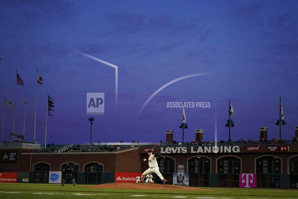Jeff Chiu San Francisco Giants' Anthony DeSclafani, center, pitches against the Colorado Rockies during the fourth inning of a baseball game in San Francisco, Monday, April 26, 2021. (AP Photo/Jeff Chiu)