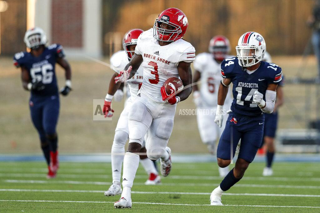 Tim Warner In this Dec. 7, 2019 photo, North Shore Mustangs running back Zachary Evans (3) runs the ball pursued by Atascocita Eagles Jordan Augustine (14) during the second half of a high school football playoff game at Sheldon ISD Panther Stadium in Houston, Texas. The talented running back from Houston quietly signed with Georgia in December, but was later released from his national letter of intent by the Bulldogs. (Tim Warner/Houston Chronicle via AP)