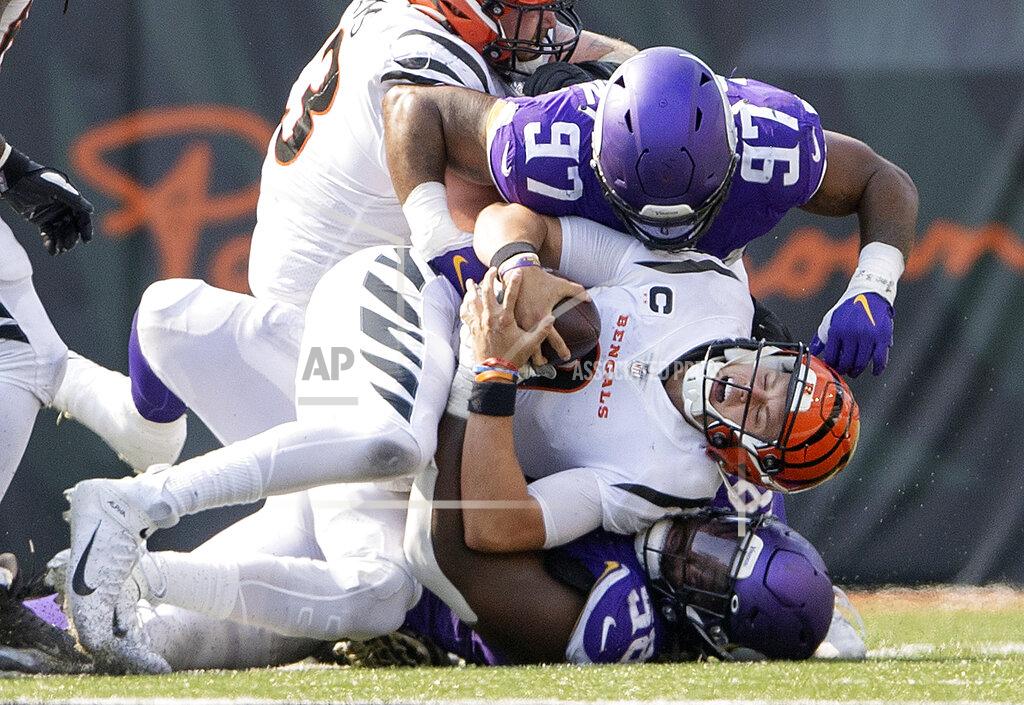 Carlos Gonzalez Minnesota Vikings defensive tackle Michael Pierce (58) sacks Cincinnati Bengals quarterback Joe Burrow in overtime of an NFL football game Sunday, Sept. 12, 2021, in Cincinnati. (Carlos Gonzalez/Star Tribune via AP)