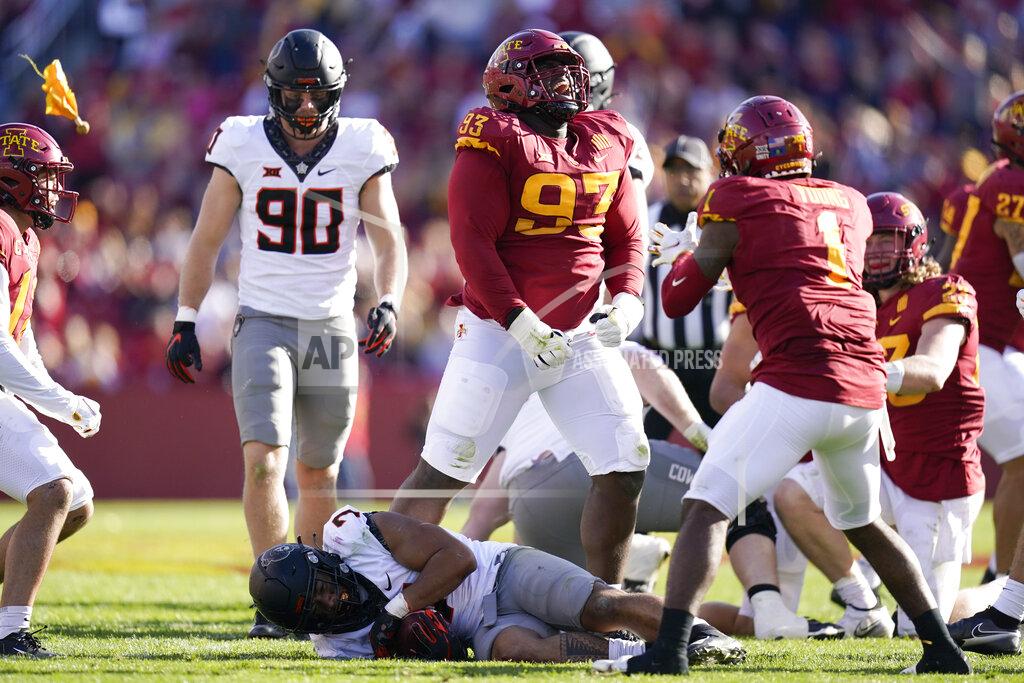 Charlie Neibergall Iowa State defensive tackle Isaiah Lee (93) celebrates after tackling Oklahoma State running back Jaylen Warren (7) during the first half of an NCAA college football game, Saturday, Oct. 23, 2021, in Ames, Iowa. (AP Photo/Charlie Neibergall)
