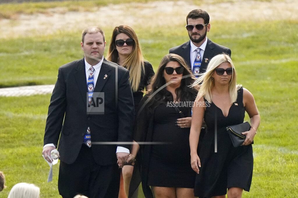 Tony Dejak Family and friends arrive for the funeral of Navy Corpsman Maxton Soviak at Edison High School Stadium, Monday, Sept. 13, 2021, in Milan, Ohio. Soviak was one of 13 U.S. troops killed in a suicide bombing at Afghanistan's Kabul airport on Aug. 26. (AP Photo/Tony Dejak)