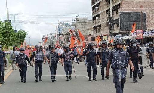 Security officers patrol during a Hindu rally in Nepalgunj, about 400 kilometers (250 miles) west of the capital, Kathmandu, Nepal, Tuesday, Oct. 3, 2023. Despite quickly escalating tensions between Hindus and Muslims, the night passed peacefully after a curfew was imposed and security heightened in a city in southwest Nepal, officials said. Communal violence is not common in Nepal, which is a Hindu majority country that turned secular just a few years ago. (AP Photo/Krishna Adhikari)