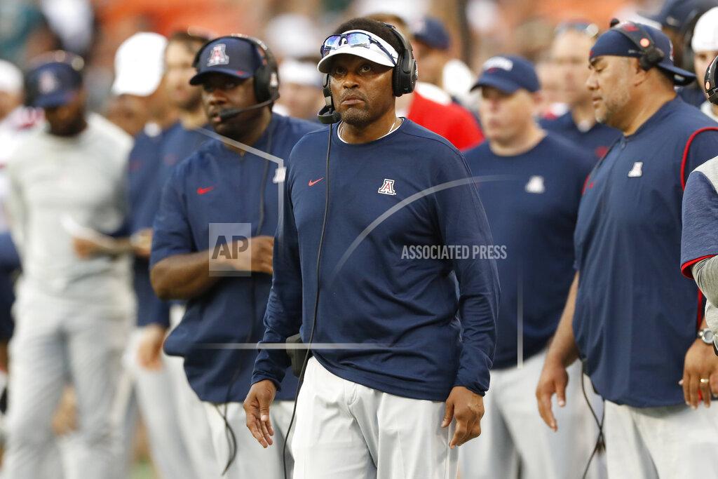 Marco Garcia Arizona head coach Kevin Sumlin, center, is seen on the sidelines during an NCAA college football game against Hawaii, Saturday, Aug. 24, 2019, in Honolulu. (AP Photo/Marco Garcia)